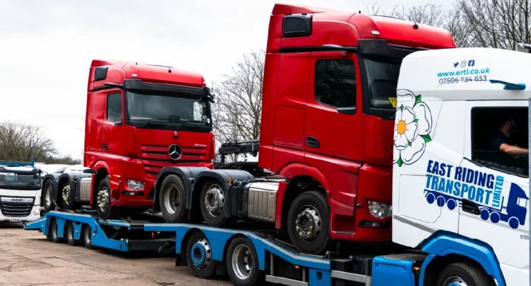 Commercial trucks being transported for export